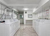 Thumbnail 16 of 16 - A clean, white industrial room with multiple machines and pipes.