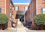 Thumbnail 4 of 15 - The front of a brick building with a sign that says 40th East Mornge Avenue.