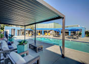 Thumbnail 54 of 71 - A pool area with a blue tarp covering the pool.