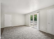 Thumbnail 13 of 15 - A room with a carpeted floor and white walls.