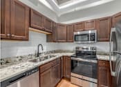 Thumbnail 13 of 22 - Kitchen with wooden cabinets at Shorehaus Lofts Apartments, Cleveland, 44113