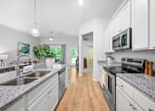 Thumbnail 6 of 33 - A beautiful kitchen with stainless steel appliances.