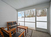 Thumbnail 13 of 26 - A sunny day in a room with a view of a snowy landscape.