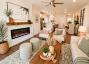 Thumbnail 41 of 47 - A living room with a fireplace and a sign that says "Breathe your way".