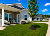 Thumbnail 45 of 47 - A house with a tree in front of it.