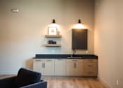 Thumbnail 10 of 31 - A kitchen with a black countertop and white cabinets.at Eastpark Apartment Homes, Salem, OR 97301