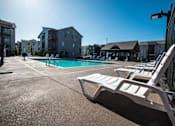 Thumbnail 12 of 31 - Poolside Relaxing Chairs at Eastpark Apartment Homes, Salem, OR