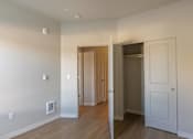 Thumbnail 33 of 51 - A room with a white door and a brown door.