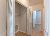 Thumbnail 46 of 51 - A white interior with a doorway leading to another room.