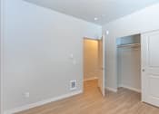 Thumbnail 49 of 51 - A room with a white door and a white wall.