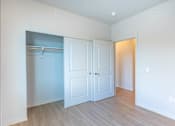 Thumbnail 58 of 82 - A room with a white door and a white wall.
