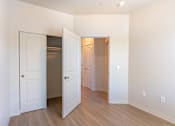 Thumbnail 66 of 82 - A room with a white door and a brown door.