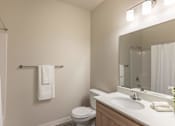Thumbnail 30 of 51 - A white towel hangs on a towel rack in a bathroom at Cascade Place Apartment Homes, Molalla, Oregon