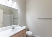 Thumbnail 47 of 51 - A white sink with a mirror above it in a bathroom at Cascade Place Apartment Homes, Molalla, OR, 97038