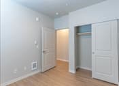 Thumbnail 51 of 51 - A room with a white door and a white wall with switches at Cascade Place Apartment Homes, Molalla, OR
