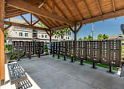 Thumbnail 17 of 36 - A row of black plaques are on display under a wooden roof at Forestplace Apartment Homes, Forest Grove, 97116