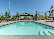 Thumbnail 21 of 36 - A pool with a gazebo in the middle of it at Forestplace Apartment Homes, Oregon