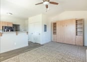 Thumbnail 30 of 36 - A living room with a ceiling fan and a television at Forestplace Apartment Homes, Forest Grove, 97116