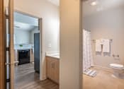 Thumbnail 34 of 36 - A bathroom with a toilet, sink, and shower at Forestplace Apartment Homes, Forest Grove, OR, 97116