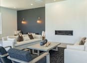 Thumbnail 2 of 25 - A modern living room with a fireplace and a grey coffee table at Northplace Apartment Homes, Salem, 97305
