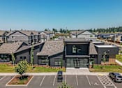 Thumbnail 25 of 25 - A row of houses with a car parked in front of them at Northplace Apartment Homes, Salem, OR, 97305