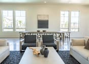 Thumbnail 3 of 25 - A living room with a white couch, a white coffee table, and a large painting on the wall at Northplace Apartment Homes, Oregon, 97305