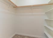 Thumbnail 31 of 72 - A white room with a carpeted floor and a staircase on the right side at Riverplace Apartment Homes, Oregon, 97351