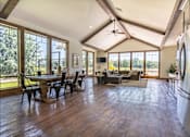 Thumbnail 47 of 72 - A spacious kitchen and dining area with wooden floors and a large window at Riverplace Apartment Homes, Independence, Oregon