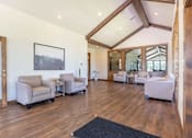 Thumbnail 49 of 72 - A living room with wooden floors and furniture at Riverplace Apartment Homes, Independence, 97351