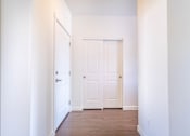 Thumbnail 6 of 72 - A white door is in the middle of a hallway at Riverplace Apartment Homes, Oregon, 97351