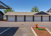 Thumbnail 66 of 72 - A fire hydrant is in front of a garage at Riverplace Apartment Homes, Independence, OR, 97351