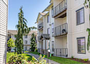 Thumbnail 69 of 72 - A sunny day at a residential apartment complex with a clear blue sky at Riverplace Apartment Homes, Independence, 97351