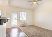 Thumbnail 7 of 72 - A room with a ceiling fan and a window at Riverplace Apartment Homes, Oregon