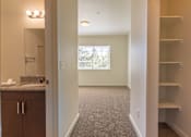 Thumbnail 9 of 72 - A room with a carpeted floor and a window at Riverplace Apartment Homes, Oregon, 97351