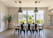 Thumbnail 21 of 28 - A dining room with a table set for six at Silverplace Apartment Homes, Silverton