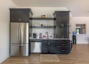 Thumbnail 22 of 28 - A kitchen with a refrigerator and a dishwasher at Silverplace Apartment Homes, Oregon, 97381