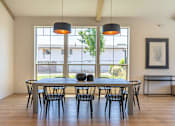 Thumbnail 15 of 22 - A dining room with a table and chairs at St Helens Place Apartment Homes, St Helens