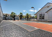Thumbnail 10 of 46 - A basketball court with a basketball hoop and a basketball net at Stoneplace Apartment Homes, Molalla