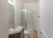 Thumbnail 27 of 46 - A bathroom with a sink, toilet, and shower at Stoneplace Apartment Homes, Oregon