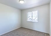 Thumbnail 45 of 46 - A room with a window and carpeted floor at Stoneplace Apartment Homes, Molalla, 97038