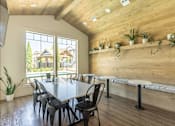 Thumbnail 4 of 12 - A dining room with a table and chairs at Timberridge Place Apartment Homes, Albany, OR
