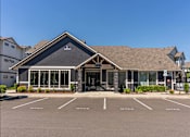 Thumbnail 8 of 12 - A building with a parking lot in front of it at Timberridge Place Apartment Homes, Albany, 97322