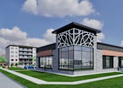 Thumbnail 5 of 24 - A modern building with a glass facade and a unique geometric design tops a long row of similar buildings.