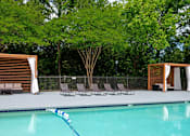 Thumbnail 7 of 16 - A pool with a blue rope in the middle of it.