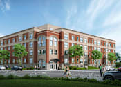 Thumbnail 1 of 8 - A large red brick building with a green lawn in front.