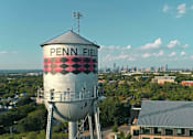 Thumbnail 14 of 19 - A water tower with the name Penn Field on it.