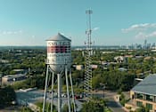Thumbnail 17 of 19 - A water tower with the name Penn Field on it.