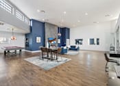 Thumbnail 4 of 23 - A modern living room with a dining table and chairs.