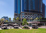 Thumbnail 22 of 27 - A large building with a circular courtyard in front of it.