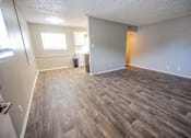 Thumbnail 32 of 34 - A room with wooden flooring and a window.